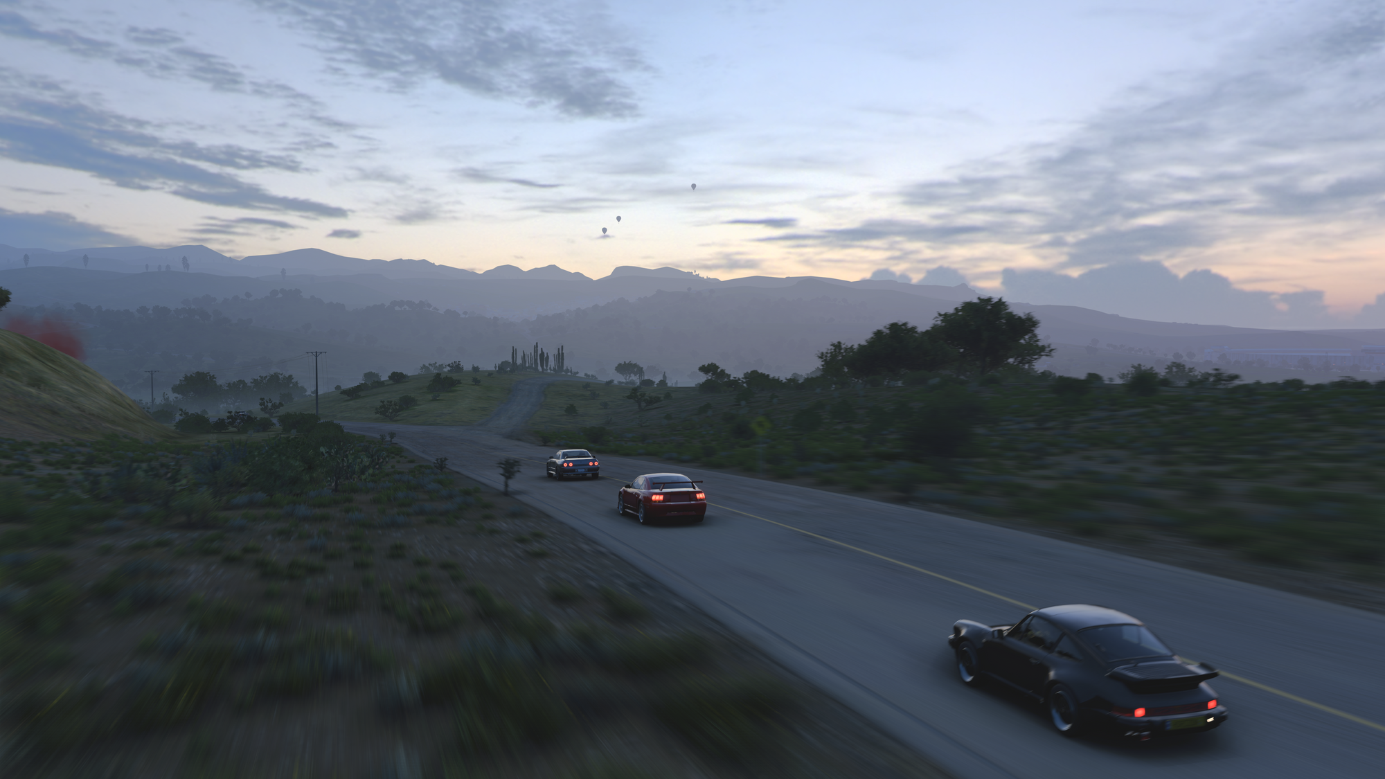 A screenshot of three cars racing in Forza Horizon 5 at dusk